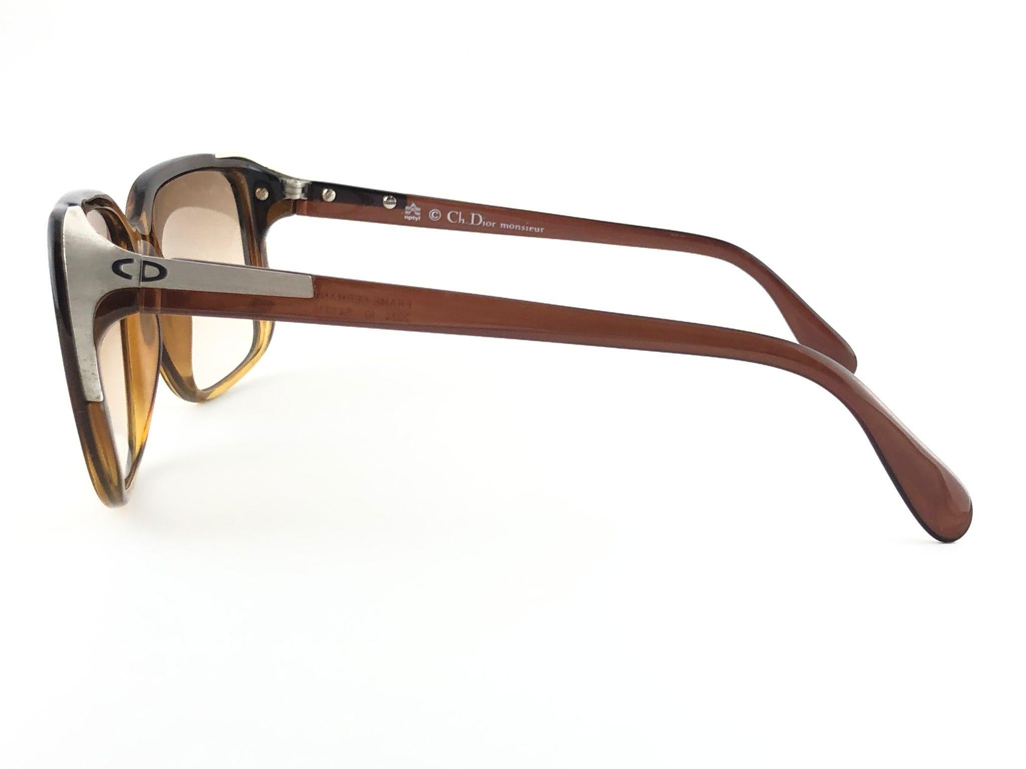 New vintage Christian Dior Monsieur two tone translucent amber frame with silver accents.

Spotless gradient light brown lenses.

New, never worn or displayed this item may show light sign of wear due to storage.

Made in Germany

Front :           