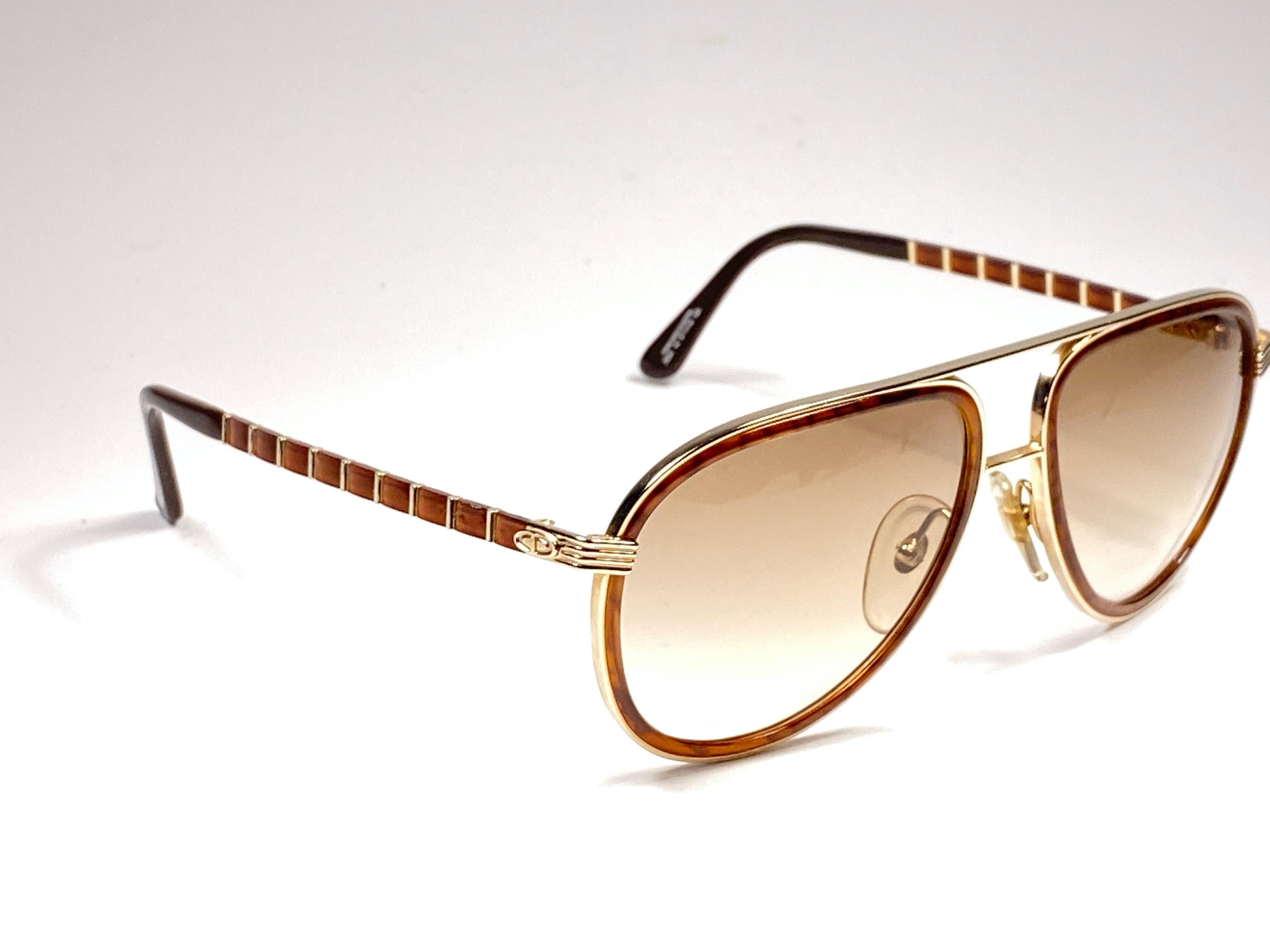 New vintage Christian Dior Monsieur sunglasses. .

Spotless brown gradient lenses.
New, never worn or displayed this item may show light sign of wear due to storage.

Made in Austria

MEASUREMENTS :

FRONT : 14 CMS

LENS HEIGHT : 5 CMS 

LENS WIDTH