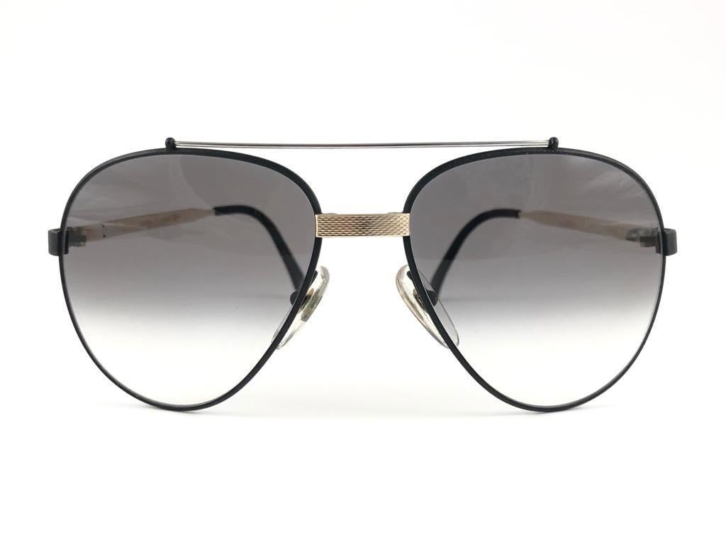 
New 1980 Dunhill black aviator frame. Grey (uv protection) lenses. 
These are like a pair of jewels on your nose.
Beautiful design and a real sign of the times. 

This piece may show minor sign of wear due to storage.
1980's designed and