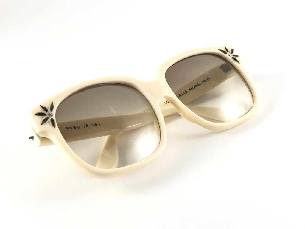 New Vintage Emanuelle Kahn beige frame with spotless brown gradient lenses.  Made in Paris. 
Produced and design in 1980's.  
New, never worn or displayed. Please consider this item is nearly 40 years old and could show minor sign of wear due to