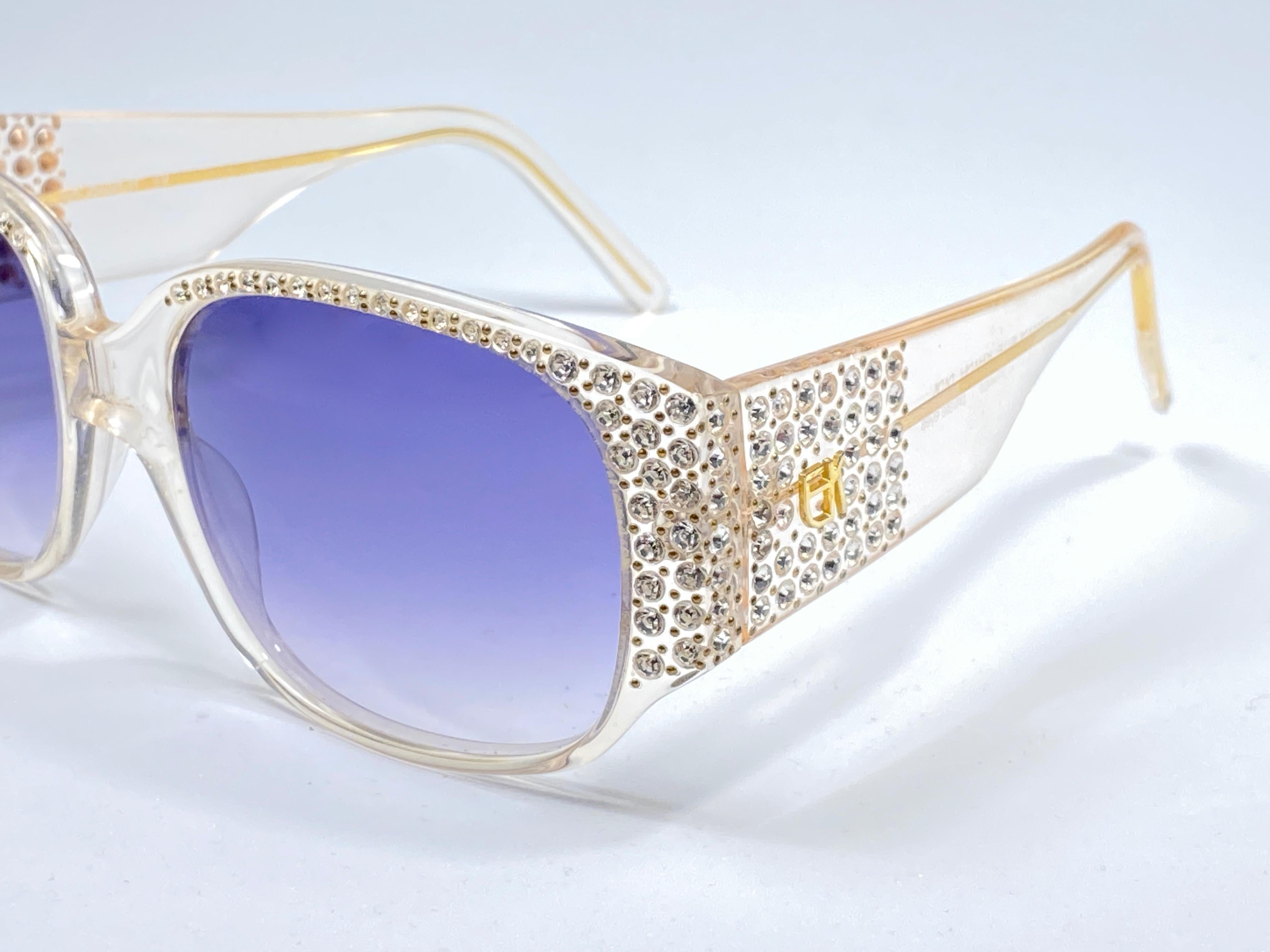 New Vintage Emmanuelle Khahn rhinestones detailed frame with spotless light lenses.  Made in Paris. 
Produced and design in 1980's.  

New, never worn or displayed. Please consider this item is nearly 40 years old and could show minor sign of wear