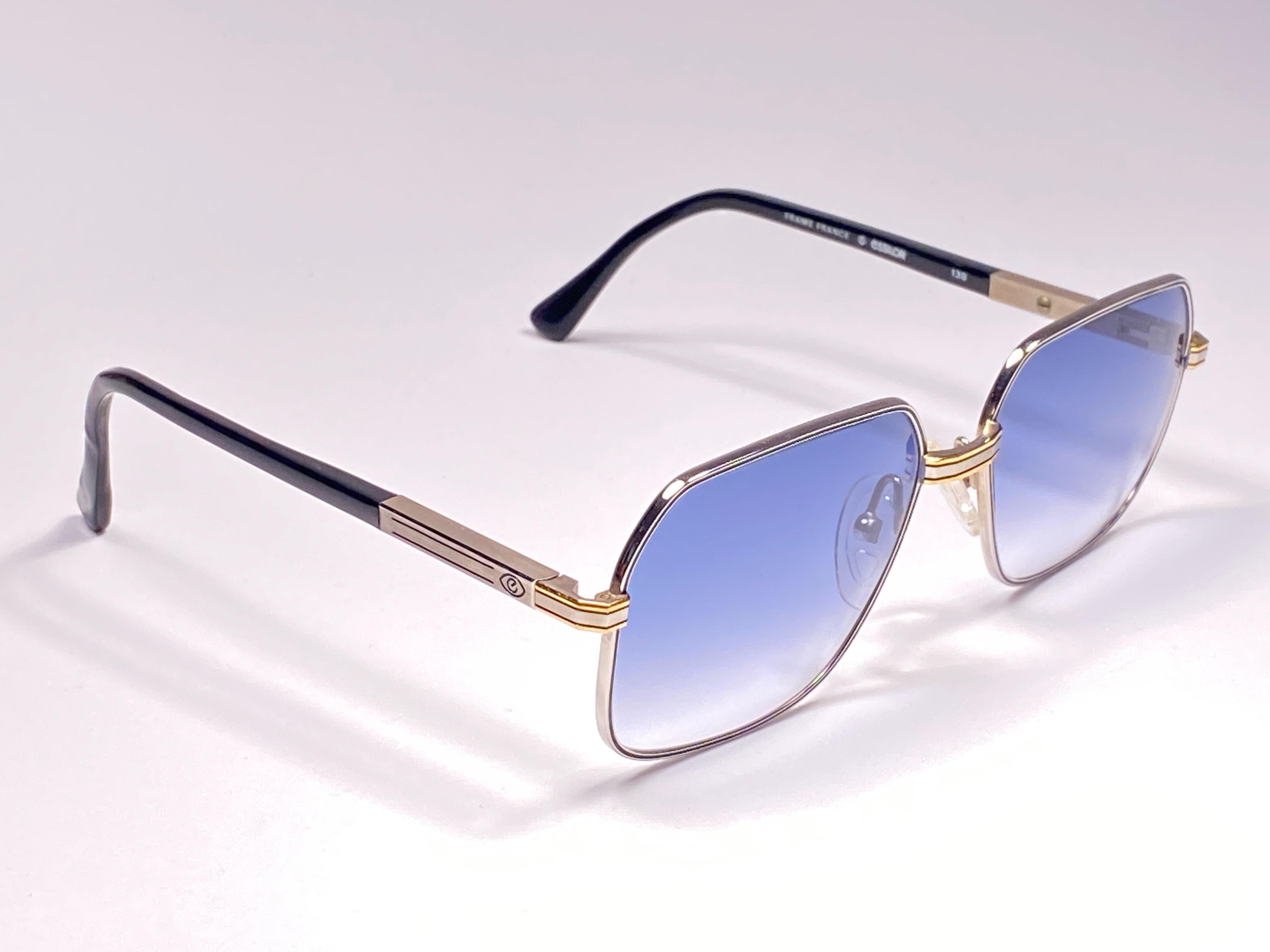 New Vintage Essilor with yellow and white gold accents sunglasses. 

Sturdy and cool frame sporting a pair of blue gradient lenses.  

Never worn or displayed. 
This item may show minor sign of wear due to nearly 40 years of storage.  Designed and