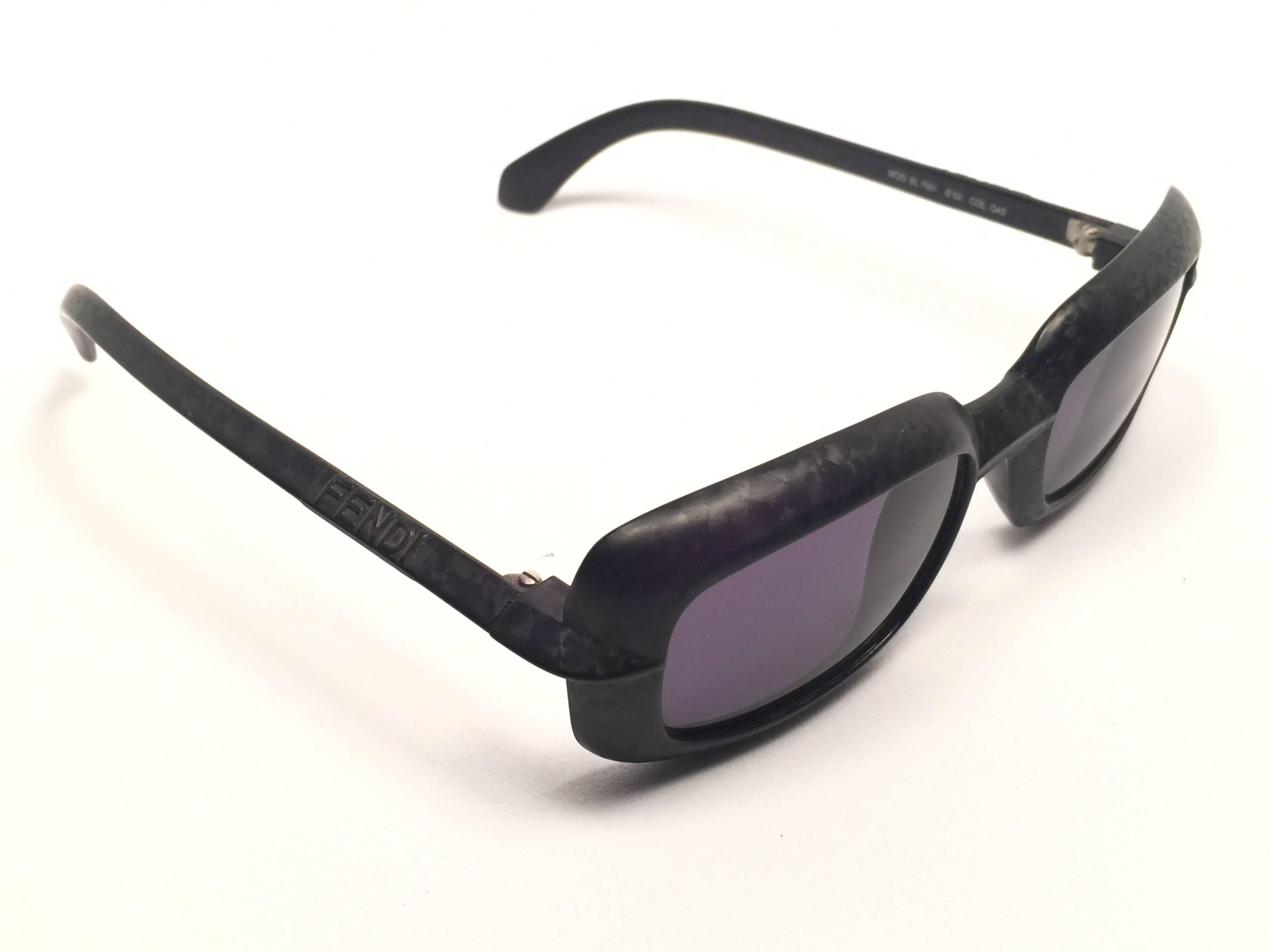 New Fendi textured square black matte frame with grey G15 ( UV protection ) lenses.

Made in Italy.
 
Produced and design in 1990's.

New, never worn or displayed.