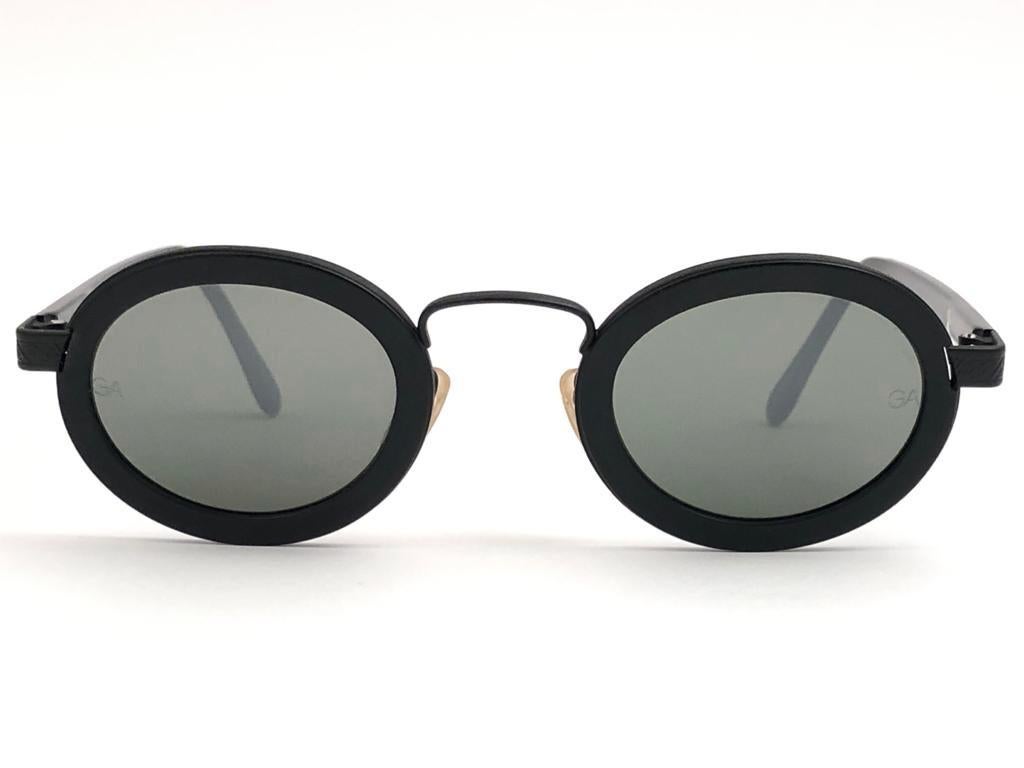 New Vintage Giorgio Armani small oval black frame with G15 brown lenses.

Made in Italy.
 
Produced and design in 1990's.

New, never worn or displayed.

FRONT : 13.4 cms
LENS HEIGHT : 3.5 CMS
LENS WIDTH : 4.2 CMS
