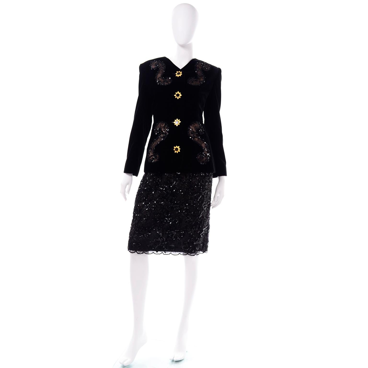 This black velvet Givenchy Couture skirt suit is embellished with black sequins and lace.  We love the bold gold tone starburst and black enamel buttons on the jacket. The black velvet jacket has incredible lace and sequin swirls on the bust and the