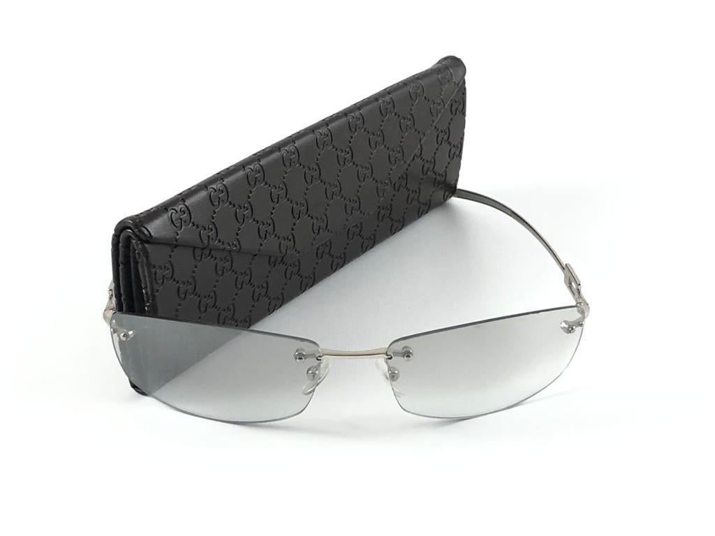 New Vintage Gucci Silver Rimless Frame with Light Gradient Grey Lenses.
New never worn or displayed. 
This item could show minor sign of wear due to nearly 30 years of storage. Made in Italy.

Front                       13.5   cm
Lens Hight        