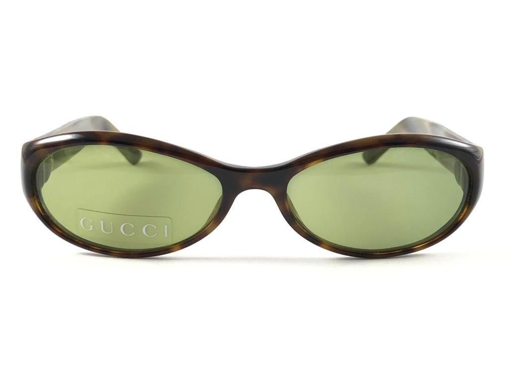 New Vintage Gucci Tortoise Oval Frame with Light Green lenses. 
New never worn or displayed. 
This item could show minor sign of wear due to nearly 30 years of storage. Made in Italy.

Front                       13   cm
Lens Hight              3  