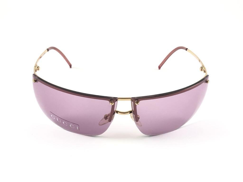 New Vintage Gucci Gold Half Frame with Medium Pink Lenses.
New never worn or displayed. 
This item could show minor sign of wear due to nearly 30 years of storage. Made in Italy.

Front                   13.5   cm
Lens Hight           3.9   cm
Lens