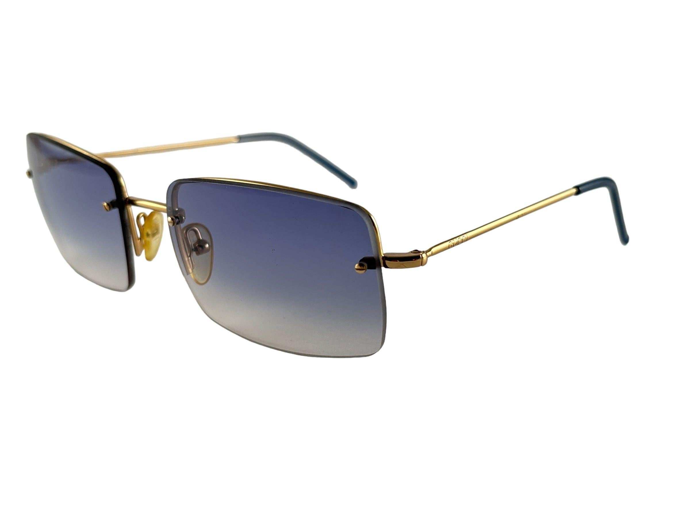 New Vintage Gucci Rimless Y2K Blue Gradient Rimless Sunglasses.
New never worn or displayed. 
This item show sign of wear on the lenses due to nearly 30 years of storage. Made in Italy.

Front                     13   cm
Lens Hight           4   