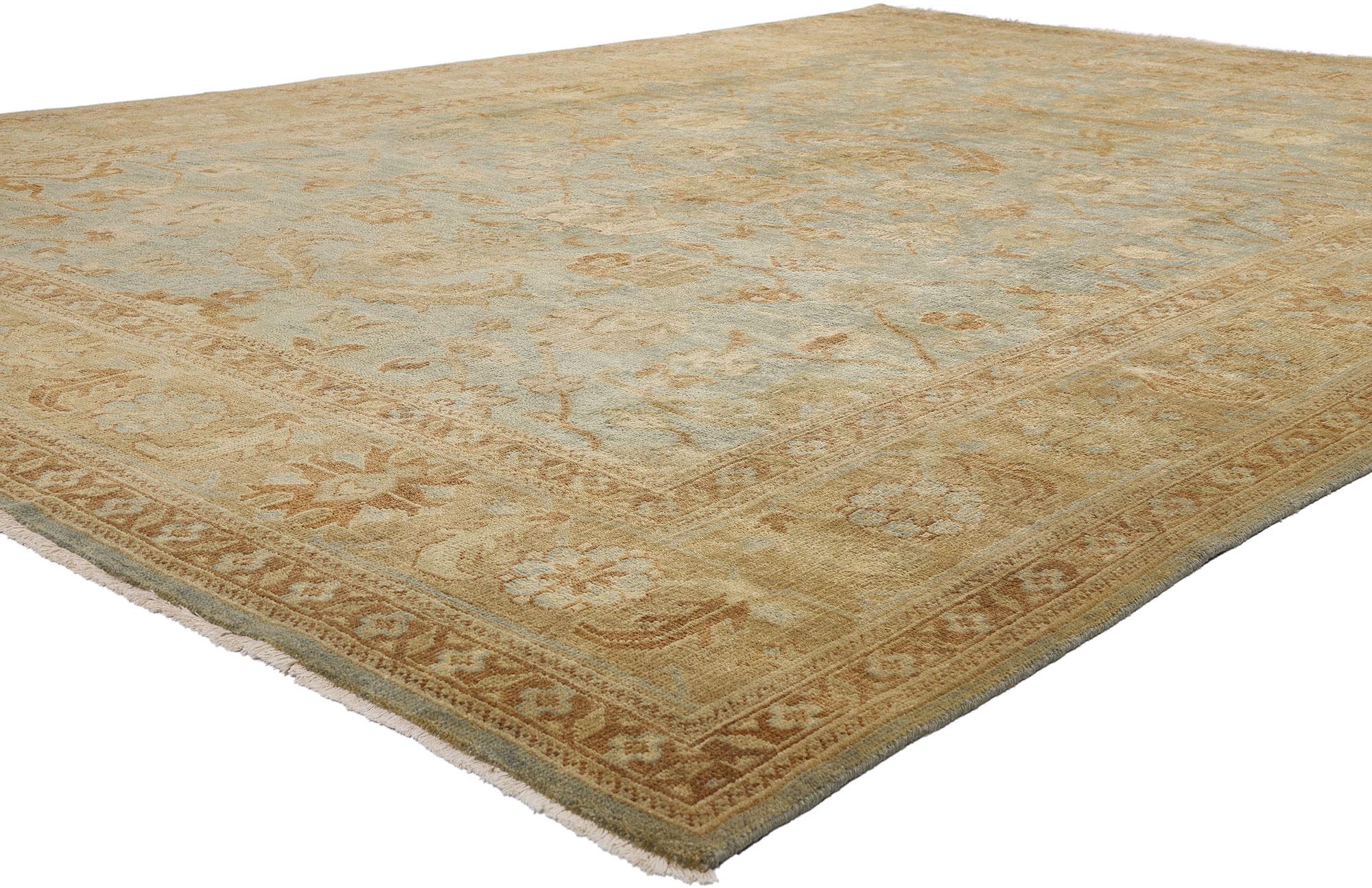 30185 New Modern Oushak Rug, 09'05 x 13'06. A testament to timeless refinement, this hand-knotted wool Oushak rug—woven in the ateliers of India—evokes the legacy of imperial elegance with a modern soul. Its pale green field, delicately faded as if