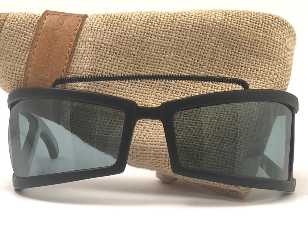 

This ultra rare pair of Issey Miyake Man black matte frame 
After almost 40 years, Issey Miyake designed and produced in the 1980's still remains one of the most iconic pieces of eyewear & fashion history.
Dark Grey lenses. New, never worn or