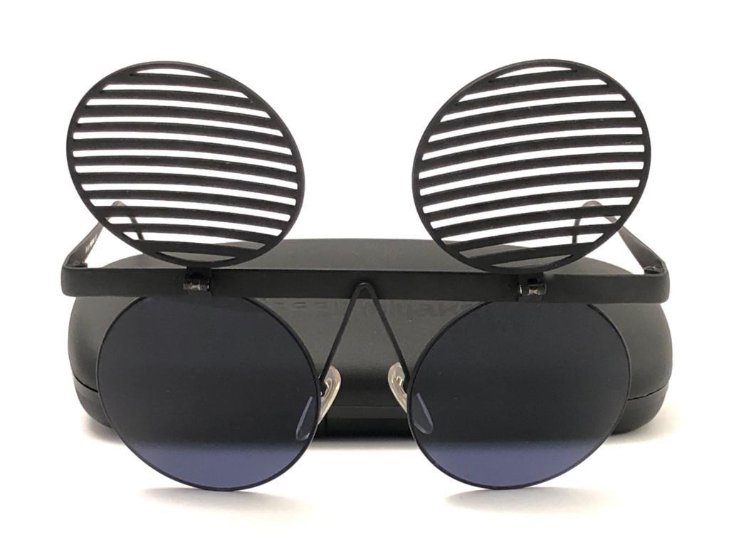Seldom is an understatement. This pair of Issey Miyake Suburbia shutters are the epitome of craftsmanship & design. The same coveted and celebrated model in black matte tone worn by Neil Francis Tennant lead singer of the synthpop duo Pet Shop Boys