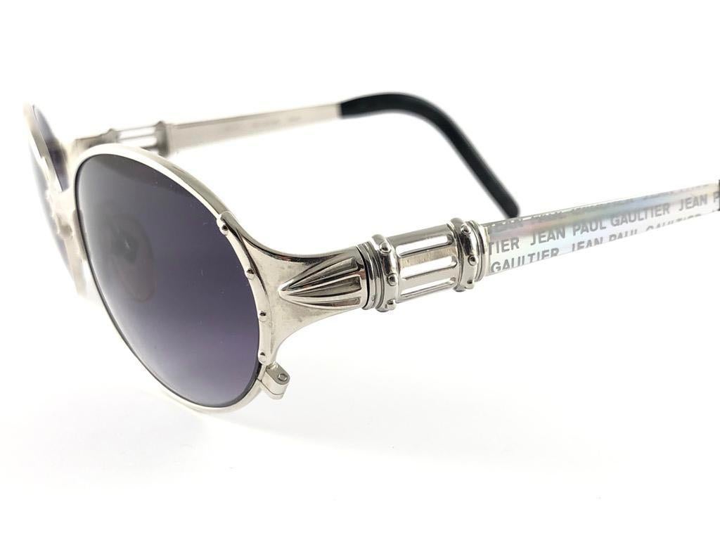 New Jean Paul Gaultier 56 5106 Oval frame. 
Gradient purple lenses that complete a ready to wear JPG look. 
Amazing design with strong yet intricate details. 
Design and produced in the 1990's. New, never worn or displayed.
A true fashion statement.