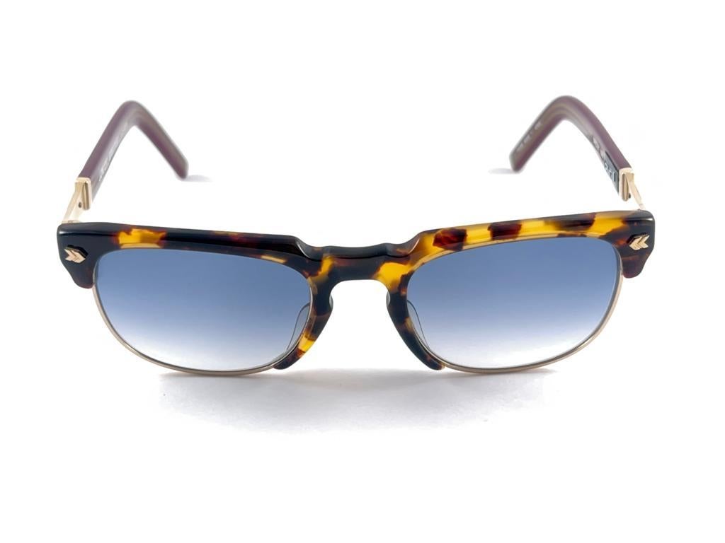 
New Vintage Jean Paul Gaultier Junior Medium Frame In Yellow Tortoise Pattern Holding A Pair Of Blue Gradient Lenses

Design And Produced In The 1900'S A Timeless And Iconic Piece.

A True Fashion Statement

Made In Japan 



Front                 