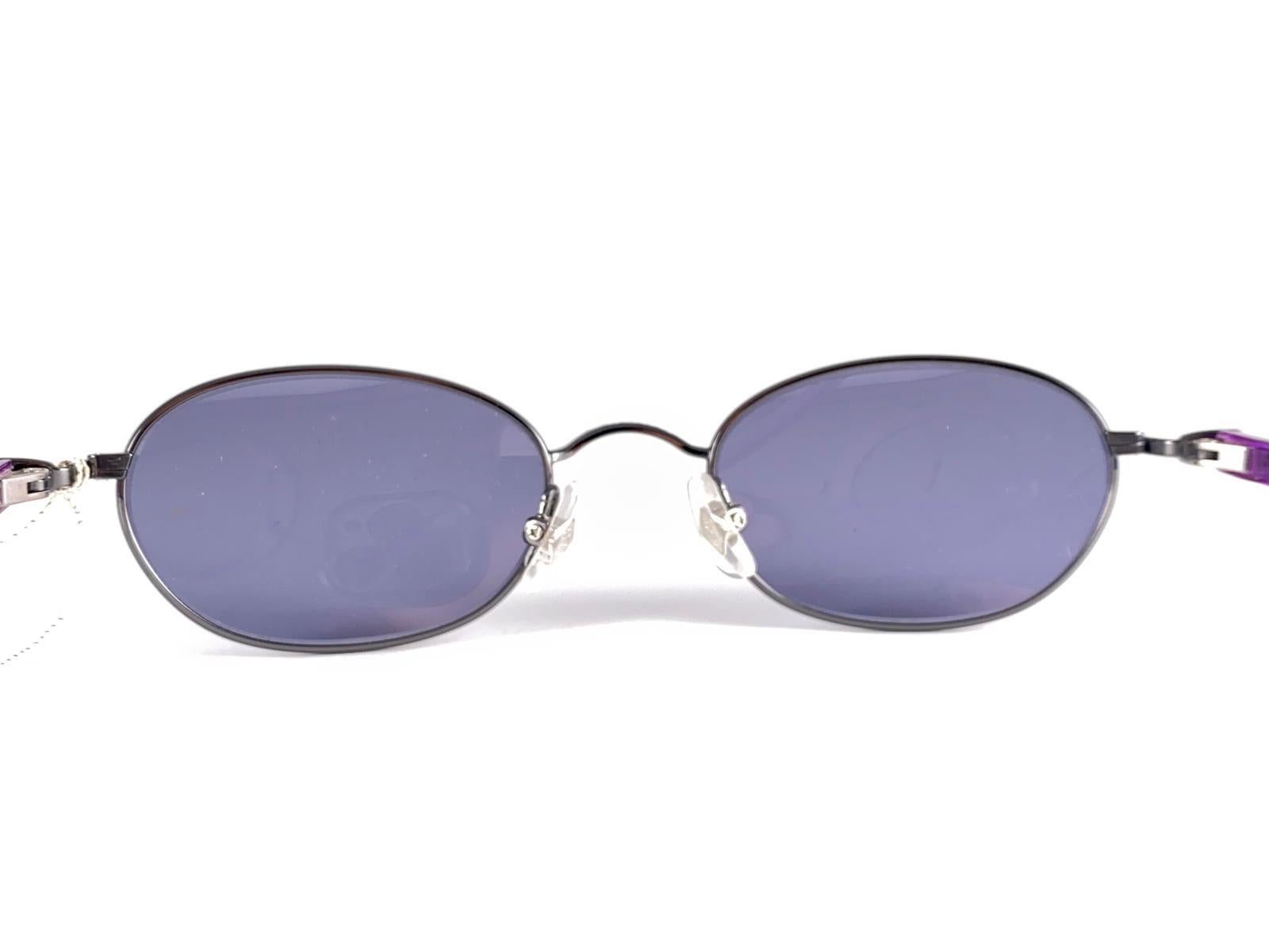 New Jean Paul Gaultier purple acetate and metal combination.
A True Fashion Statement. This Item May Show Some Sign Of Wear Due To Almost 30 Years Of Storage.
New, Never Worn Or Displayed.


Made in Japan


Front                                14   