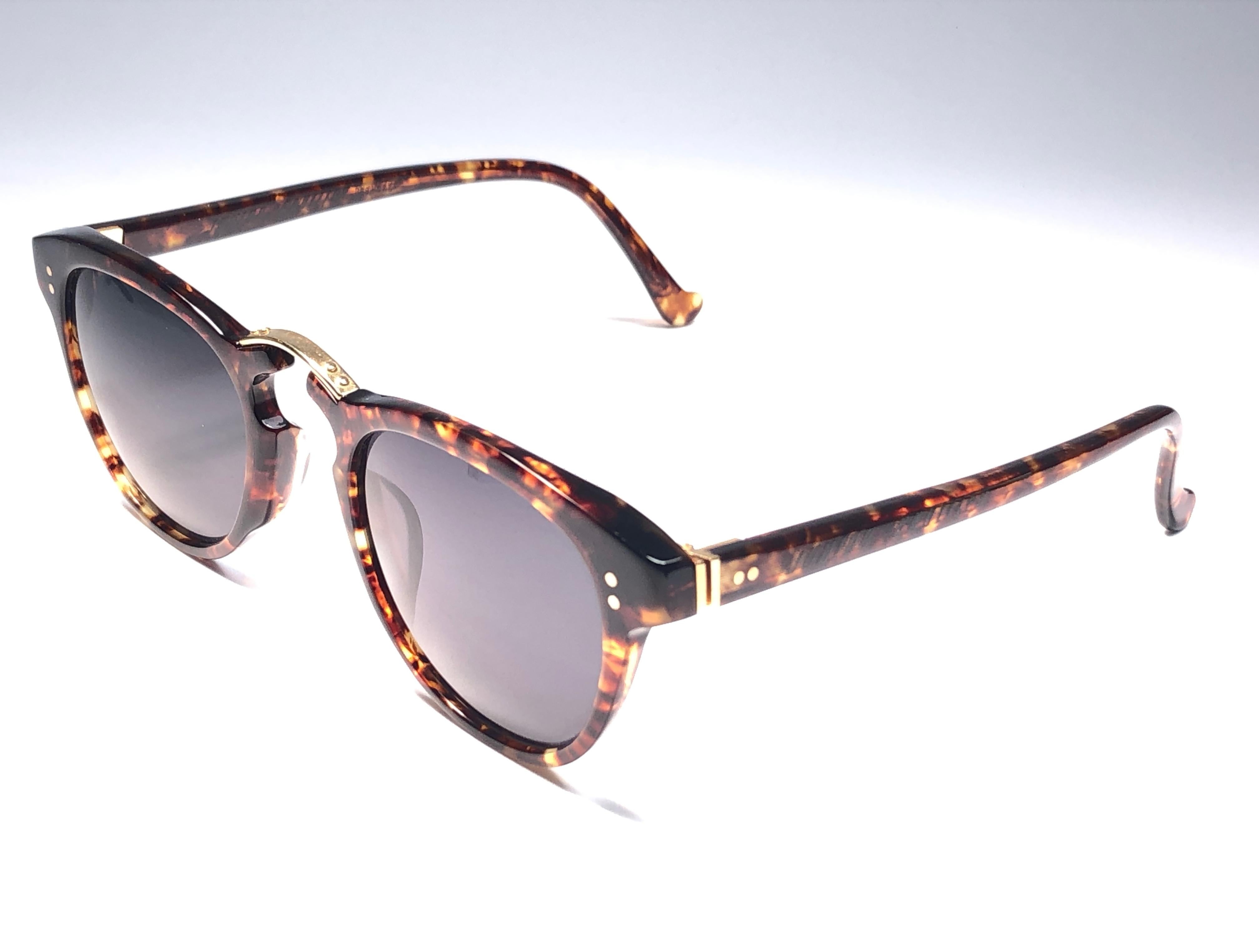 New Vintage Jean Paul Gaultier Junior medium frame in dark tortoise pattern.

Design and produced in the 1900's a timeless and iconic piece.
Minor sign of wear due to storage.
A true fashion statement.

Front 13 cms
Lens Height 4.5 cms
Lens Width