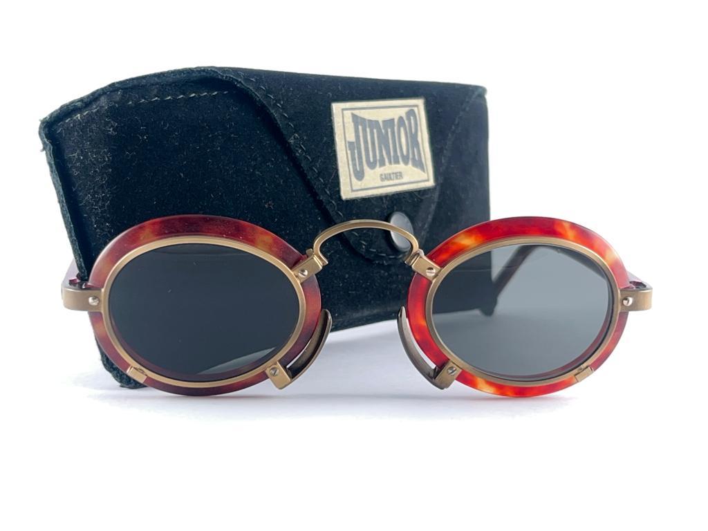 New Vintage Jean Paul Gaultier Tortoise And Copper Metal Accents Frames. The Very Same Model Worn By Miles Davis.

Design And Produced In The 1900'S A Timeless And Iconic Piece.

A True Fashion Statement.

It Comes With An Original Jean Paul