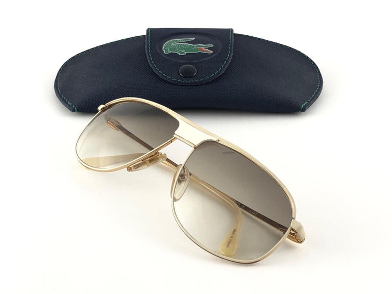Nouvelles lunettes de soleil vintage Lacoste blanches 181 avec accents  beiges, fabriquées en France, années 1980 En vente sur 1stDibs