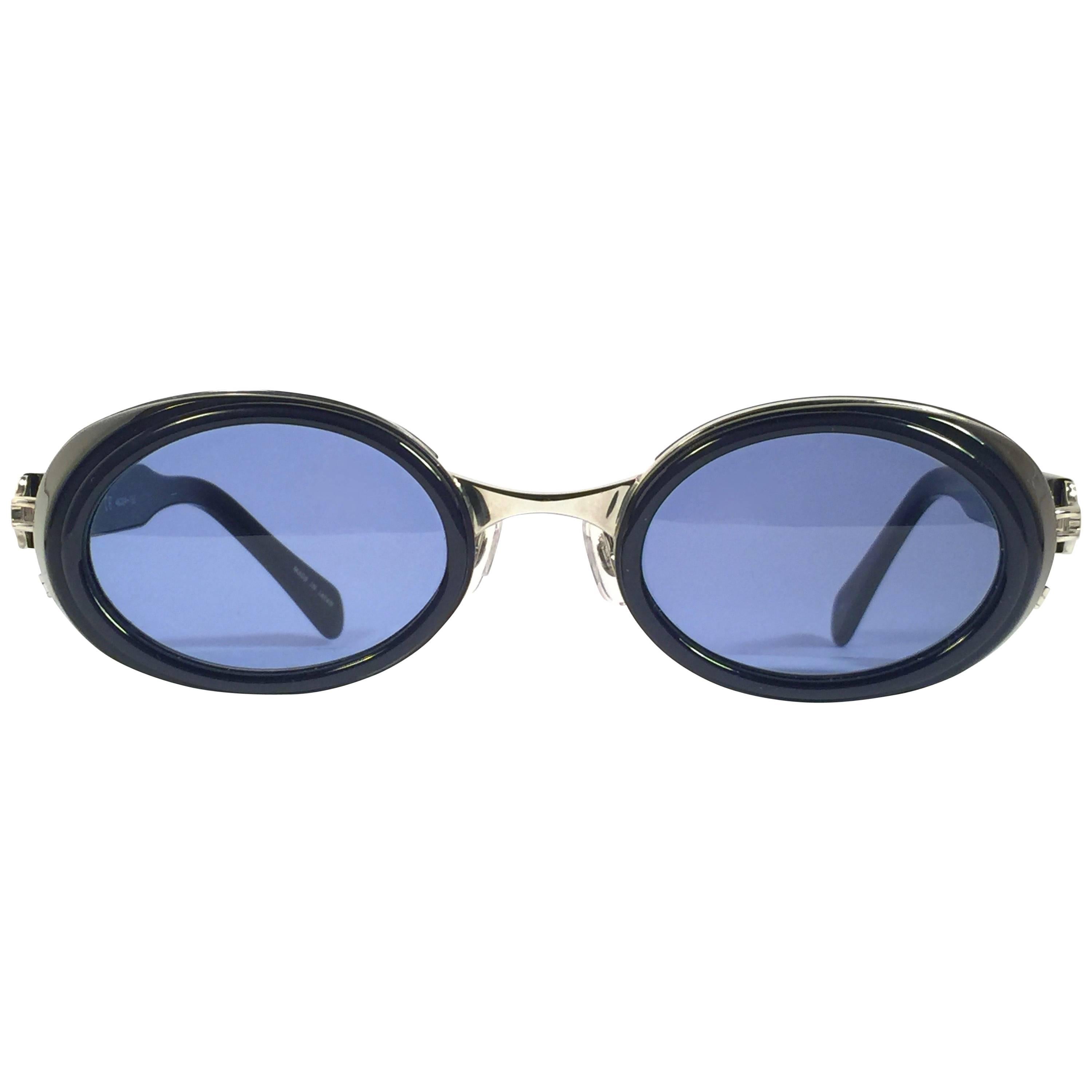 Cult brand Matsuda signed this ultra chic pair of dark blue with silver accents sunglasses. 

Spotless medium blue lenses.

Superior quality and design. 

New, never worn or displayed. This item may show minor sign of wear due to storage. Made in