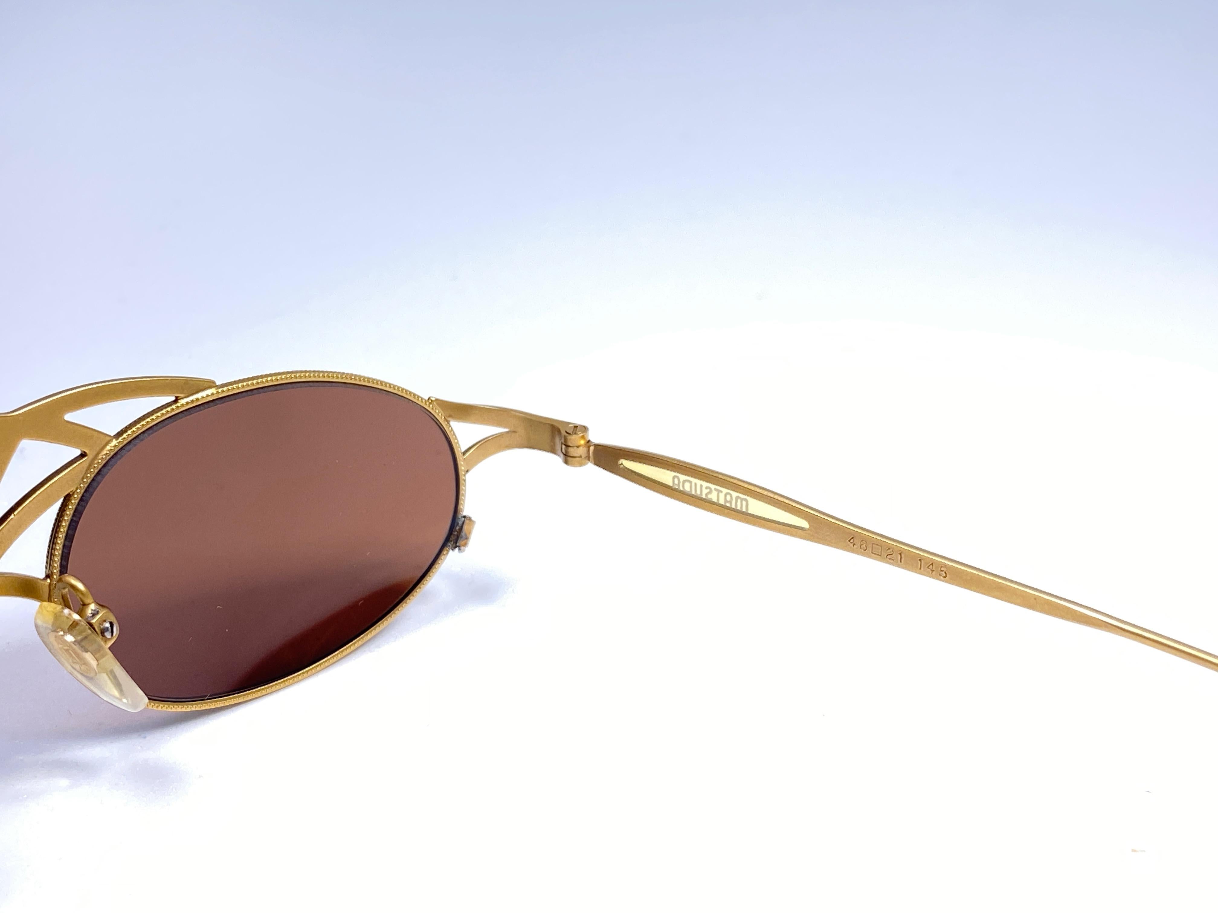 sunglasses brand with crown logo