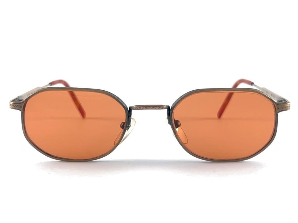 Cult Brand Matsuda Signed This Ultra Chic Pair Of 100 % Titan Frame Sunglasses

Spotless Medium Orange Lenses

Superior Quality And Design 

New, Never Worn Or Displayed 
This Item May Show Minor Sign Of Wear Due To Storage

Made in