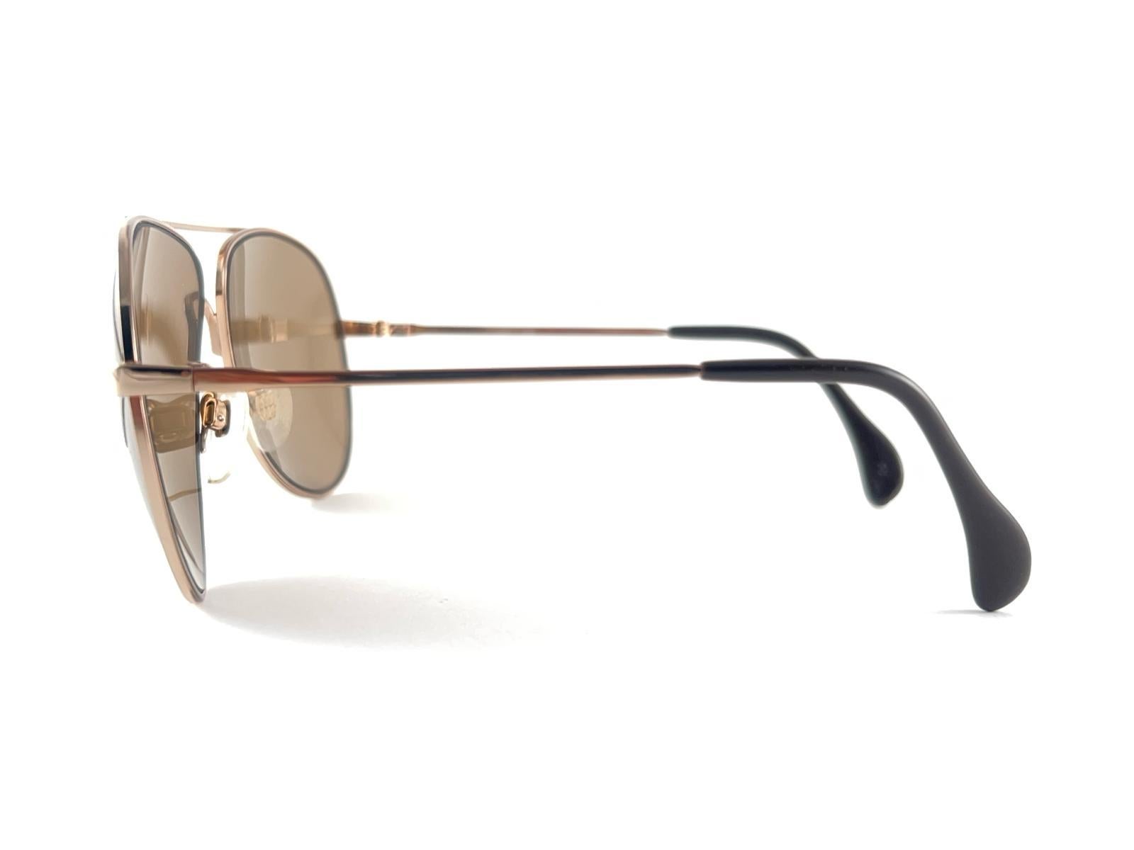 Cool New Vintage 707 Menrad Aviator Light Gold Frame With Medium Brown Lenses.
Please Note That This Beauties Are 40 Years Old And May Have Minor Sign Of Wear Due To Storage. 
Superb Quality,  Even Better Design

New, Never Worn Or Displayed 


Made