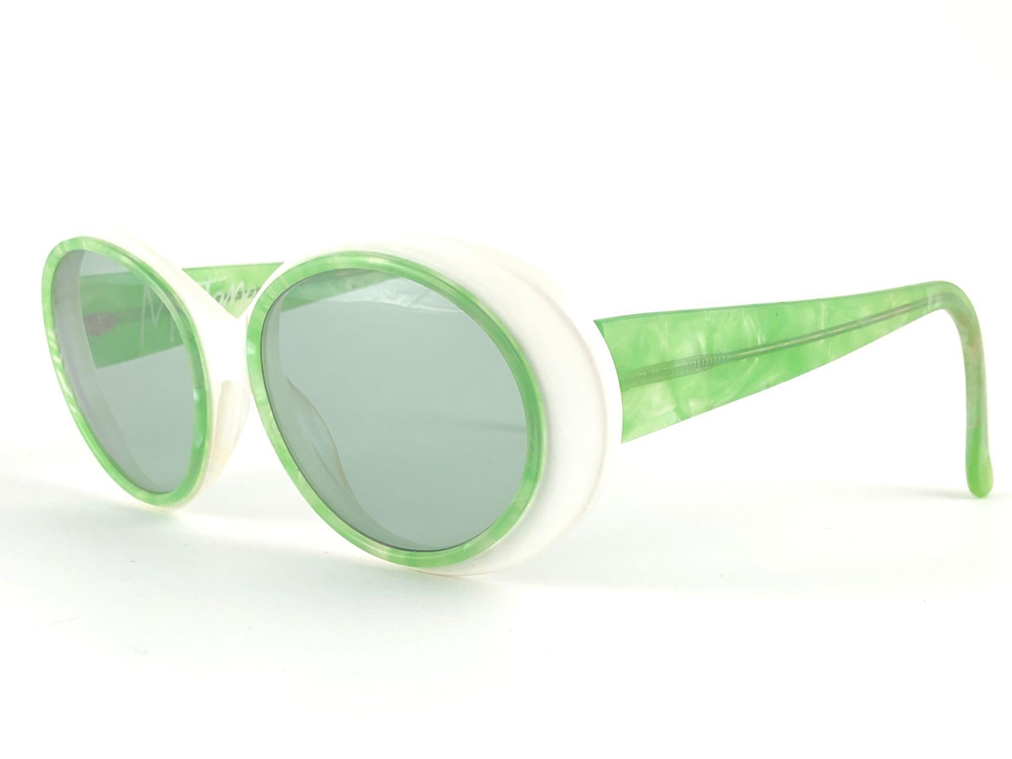 New Vintage Montana Oval white frame and Marbled light green temples.

This item is in unworn condition. Please consider that this item is nearly 30 years old so it could show minor sign of wear due to storage.  

Hand Made in