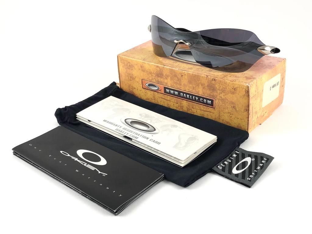 
New Vintage Oakley Dartboard Sunglasses. Black frame with black iridium lenses.
New never worn or displayed. This item might show minor sign of wear due to storage.
Comes with its original box and papers as pictured.
Made in Usa