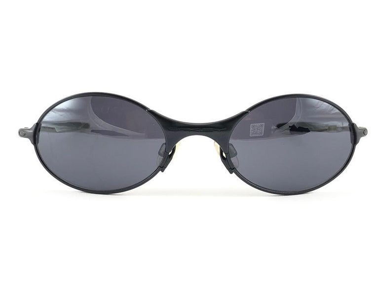 New Vintage Oakley E Wire  Black Black Iridium Lens 2001 Sunglasses For  Sale at 1stDibs