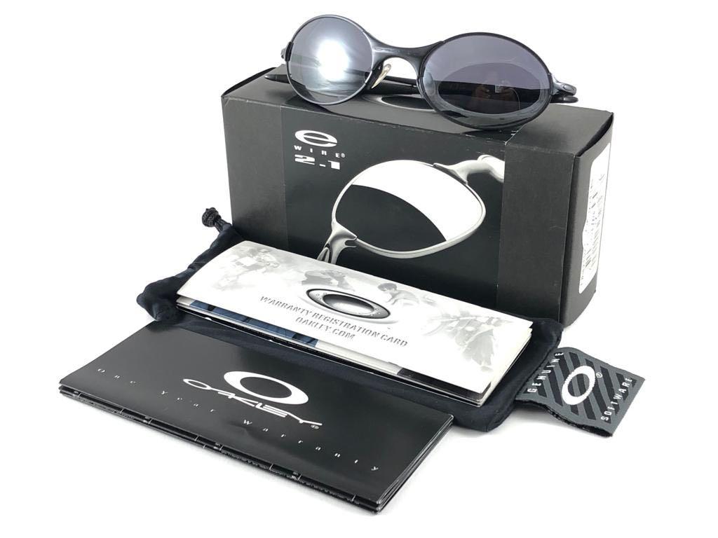 
New Vintage Oakley E wire 2.1  oval Sunglasses. Wire frame with black iridium lenses.
New never worn or displayed. This item might show minor sign of wear due to storage.
Comes with its original box and papers as pictured.
Made in Usa