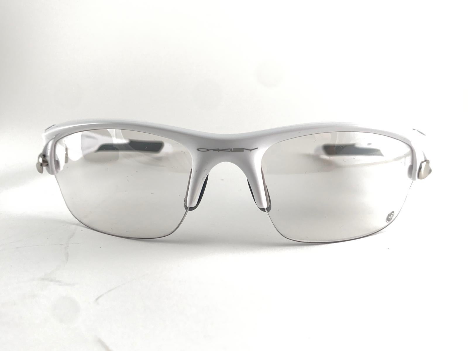 
New Vintage Oakley Flak White Half Frame Sunglasses. Wrap around sports frame with clear lenses.
New never worn or displayed. This item might show minor sign of wear due to storage.

Made in Usa