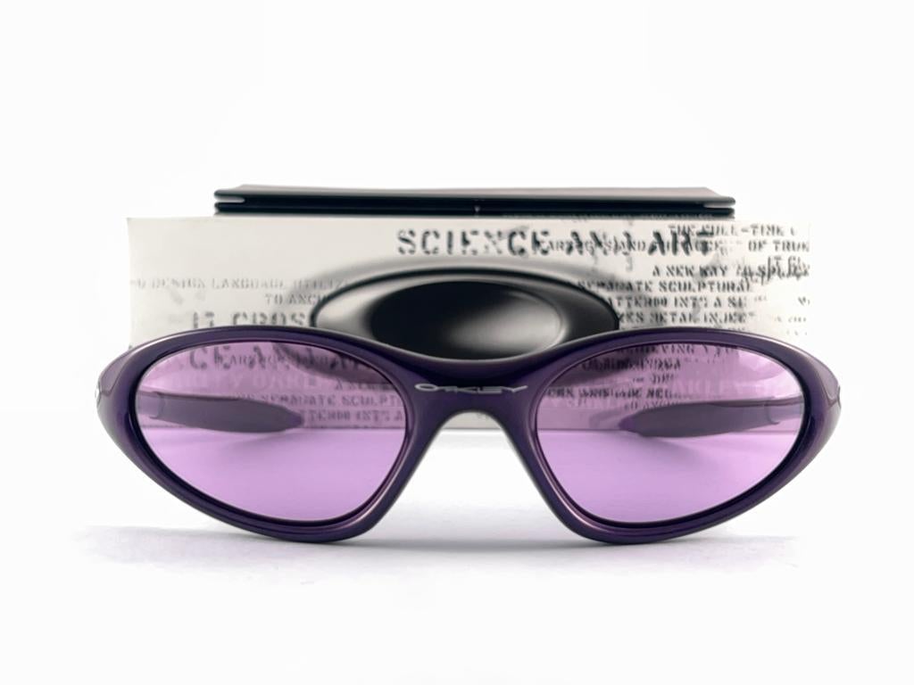 
New Vintage Oakley Minute Purple Frame Sunglasses. Wrap frame with mirror lenses.
New never worn or displayed. This item might show minor sign of wear due to storage.
Comes with its original box and papers as pictured.
Made in Usa