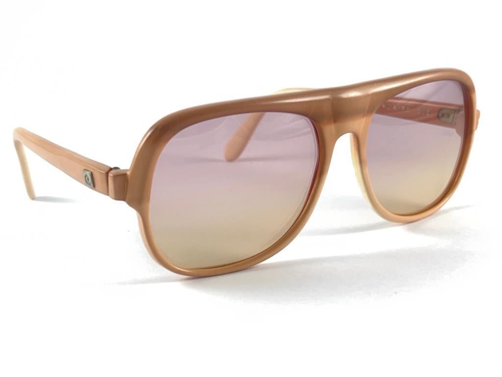 New vintage Pierre Cardin oversized two tone ombre frame sporting a beautiful pair of two tone lenses.
This pair have minor wear on them due to to nearly 70 years of storage and some letters have fade on the temple. Please study the images.
This