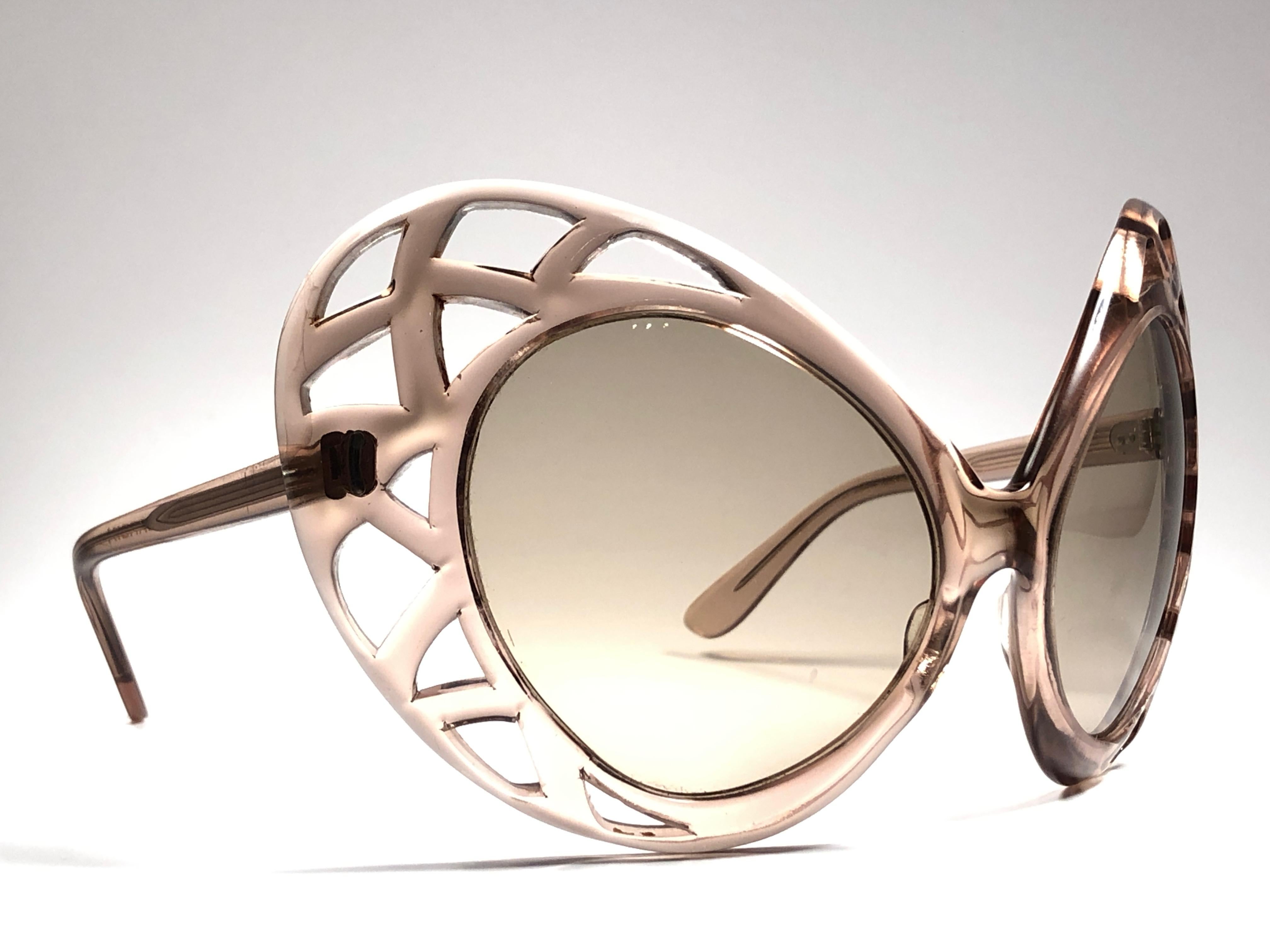 Vintage new Pierre Cardin Oversized translucent frame sporting a pair of light brown lenses. 
Designed and produced in the 1960’s.   

This pair of vintage Pierre Cardin is a collectors must have. 

A piece of sunglasses and fashion history.

This