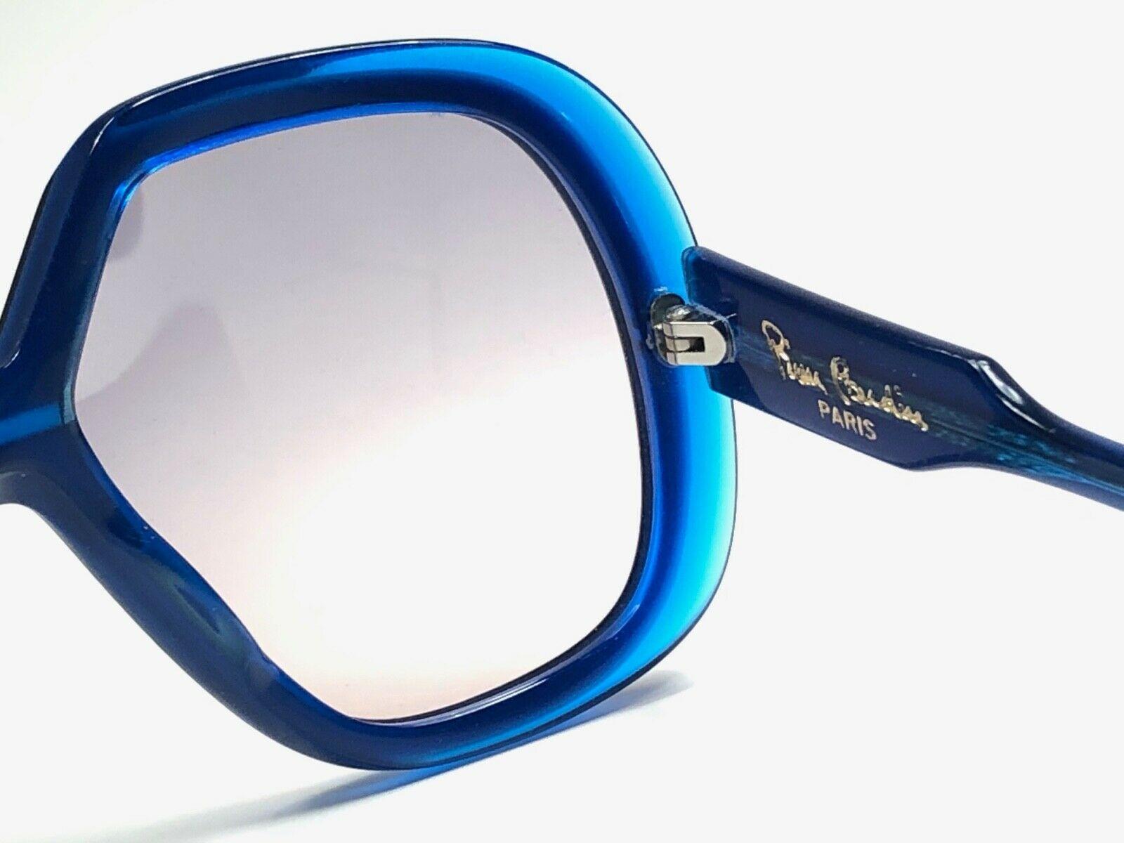 
New Vintage Pierre Cardin vibrant blue frame with grey lenses. 

This pair has slight wear on them due to 50 years of storage.  

New, never worn or display. A must have!