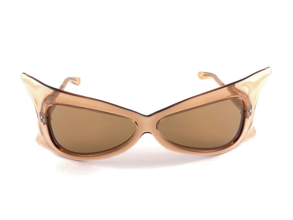 Vintage New Pierre Cardin Wrap Oversized Translucent Brown 1960’S . 
This Pair Of Vintage Pierre Cardin Is A Rare And Sought After Piece Not To Miss Out
A Piece Of Sunglasses And Fashion History.
This Frame Is In  New Condition, It May Show Minor