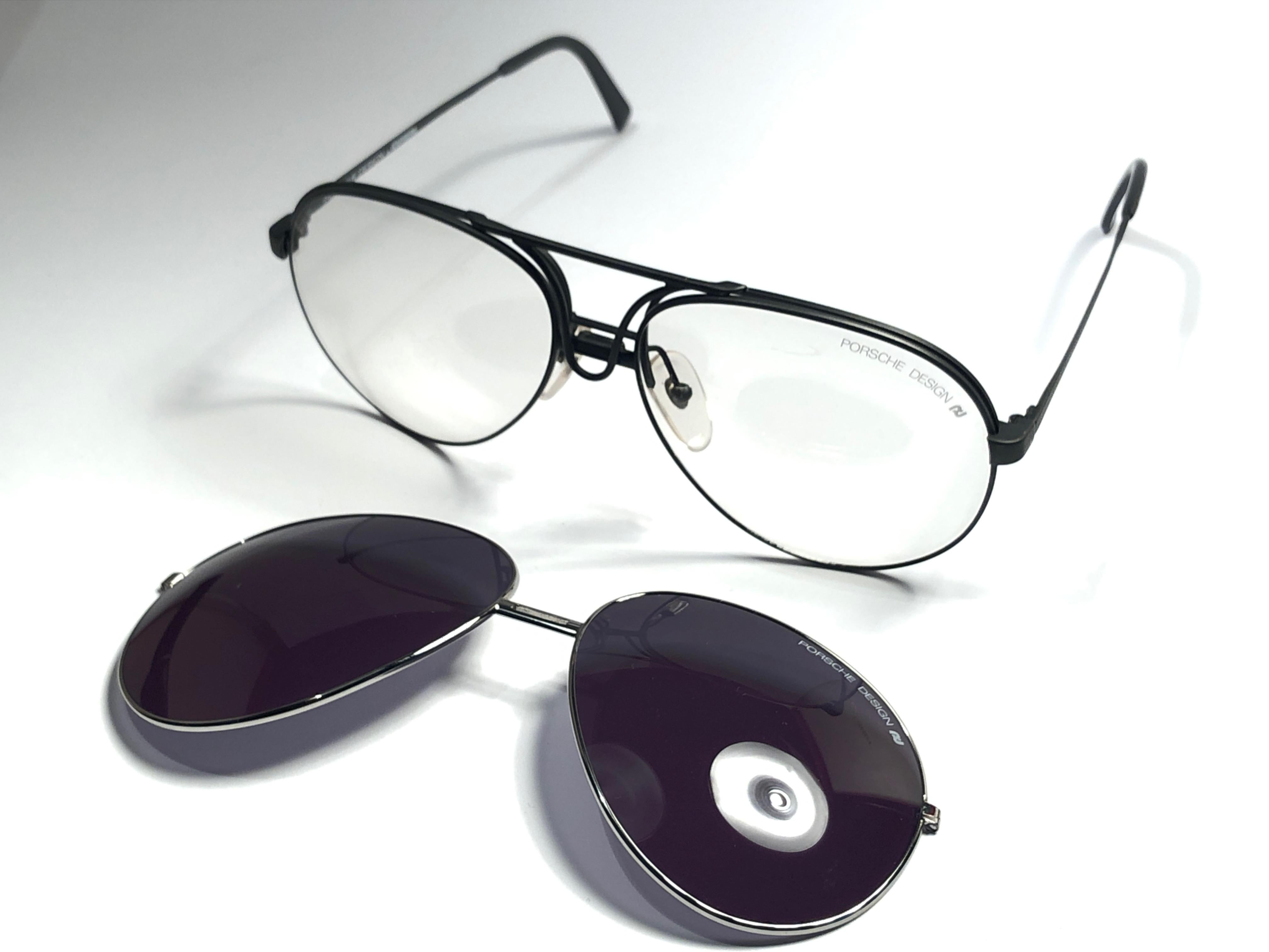 New 1980's Porsche Design 5623 silver medium frame with grey lenses and extra transparent lens front.

Amazing craftsmanship and quality.  
This item show minor sign of wear due to storage specially on the extra set of lenses.
Made in Austria. 