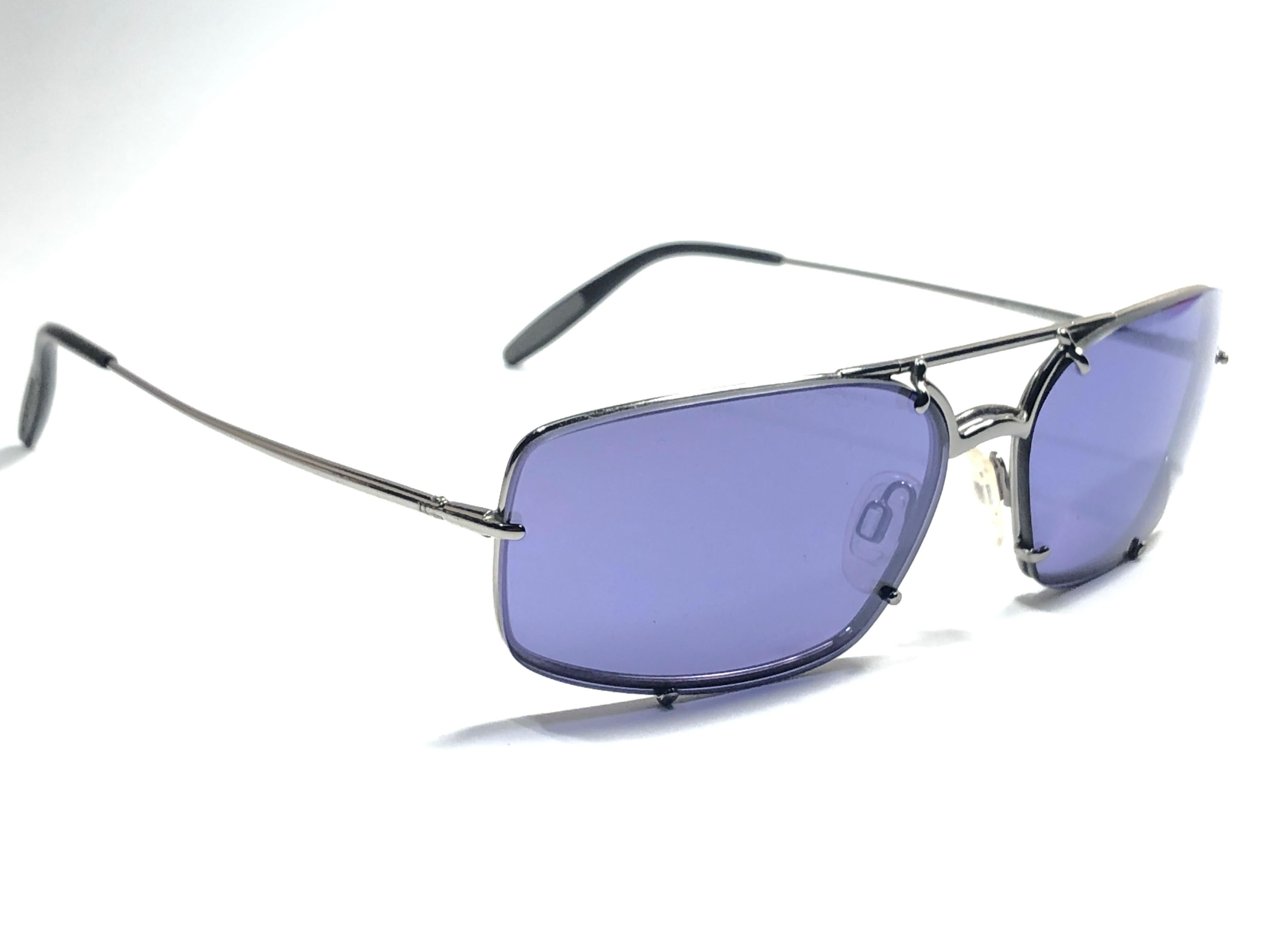 New 1980's Porsche Design P1019 silver medium frame with blue lenses.  

Amazing craftsmanship and quality.  
This item show minor sign of wear due to storage.
New, never worn.  Made in Austria. 