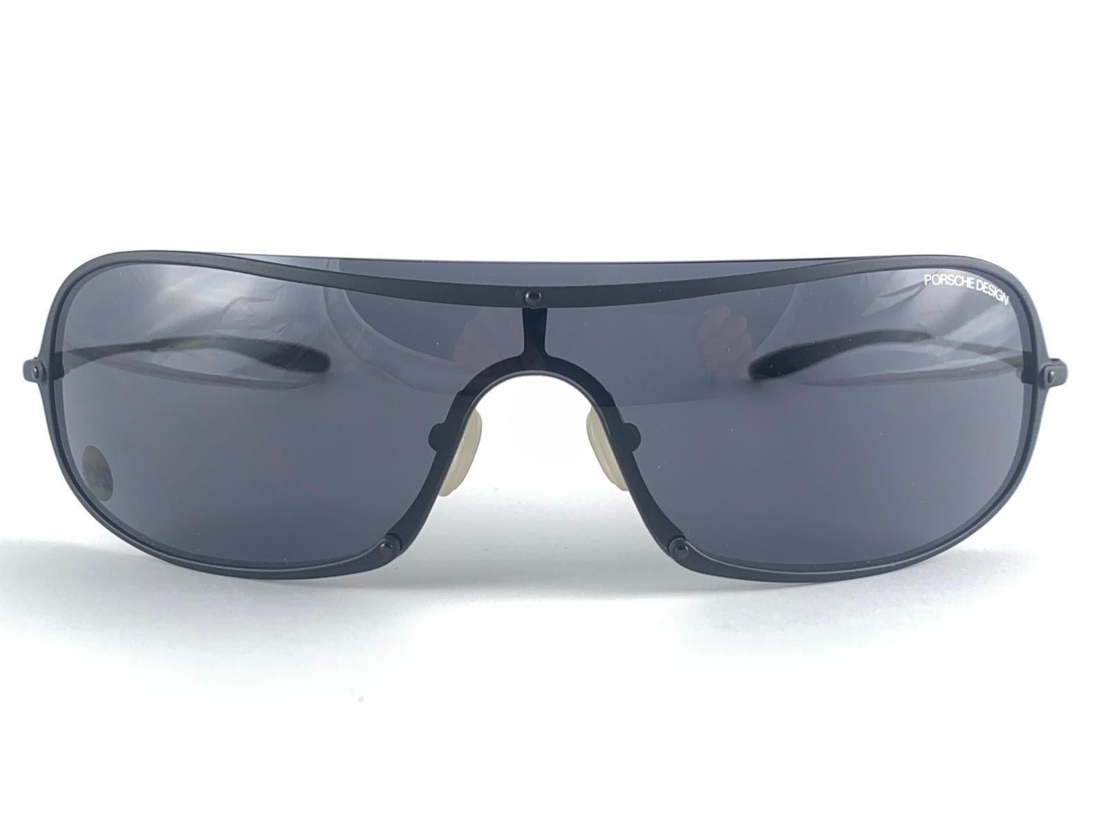 
New And Ultra Rare Collectors Item From The 1990'S, 30 Years Old. Porsche Design Blue Matte Frame With Grey Lenses.
Amazing Craftsmanship And Quality.

New, Never Worn Or Displayed. This Item Show Minor Sign Of Wear On The Lenses Due To