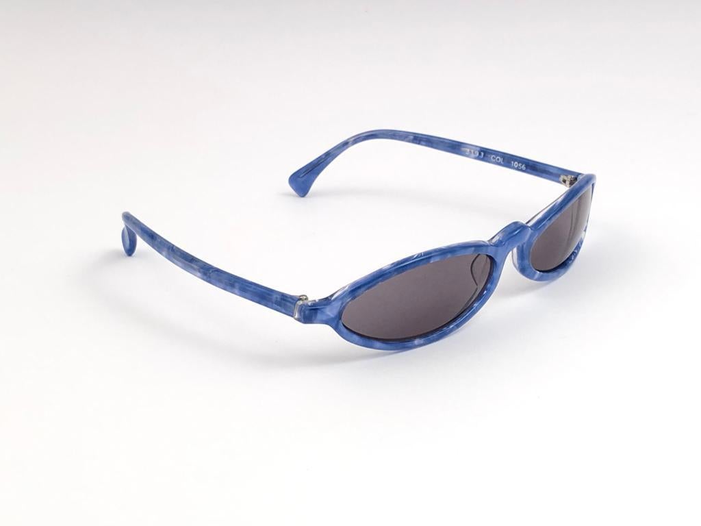 New Vintage Rare Alain Mikli cerulean blue wide frame. 

This item is in unworn condition. Please consider that this item is nearly 40 years old so it could show minor sign of wear due to storage.  

Made in France.

Front 15
Lens Height 2.5
Lens