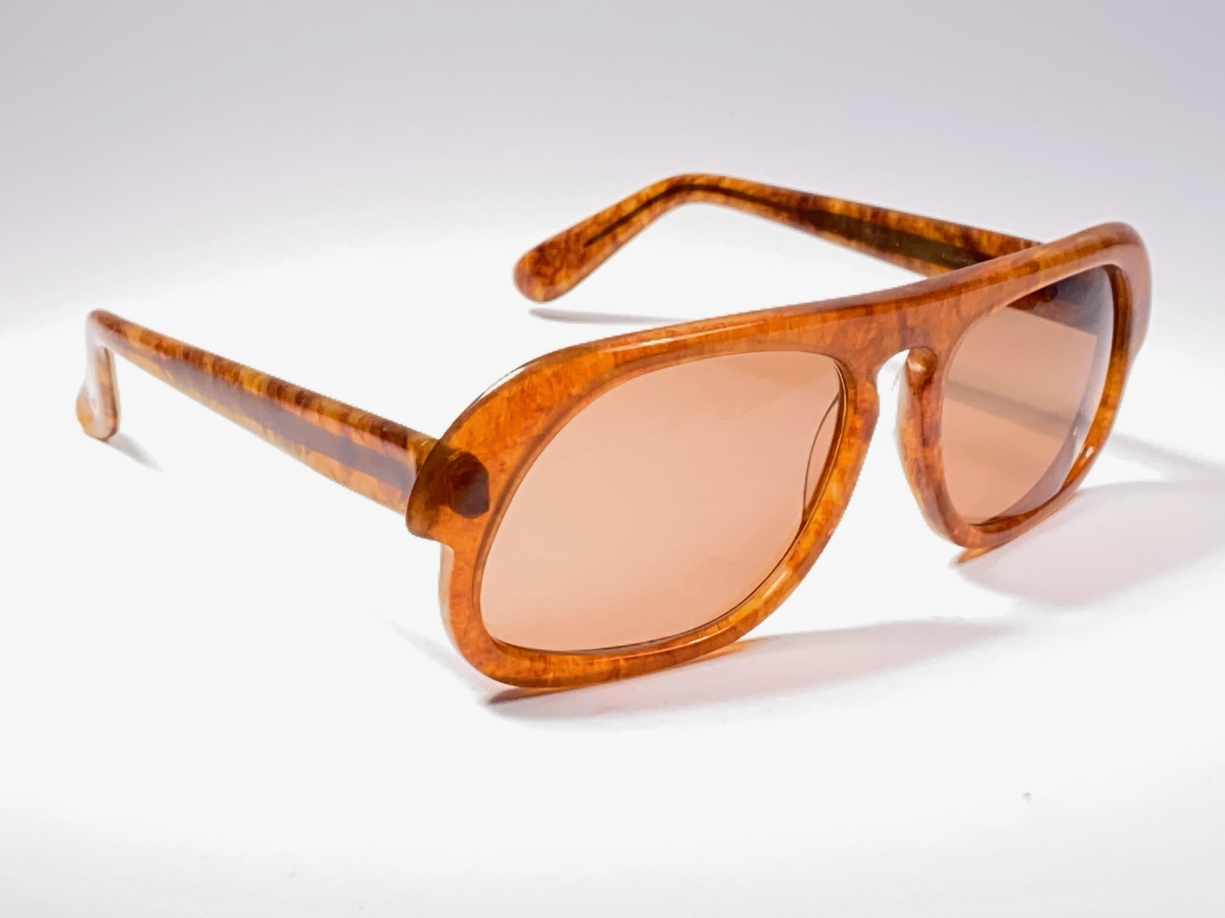 New vintage futuristic Pierre Cardin rectangular frame sporting a beautiful pair of medium brown lenses.
This pair have slight wear on them due to to nearly 60 years of storage.  
This vintage Pierre Cardin is a unique piece rarely seen up for sale.