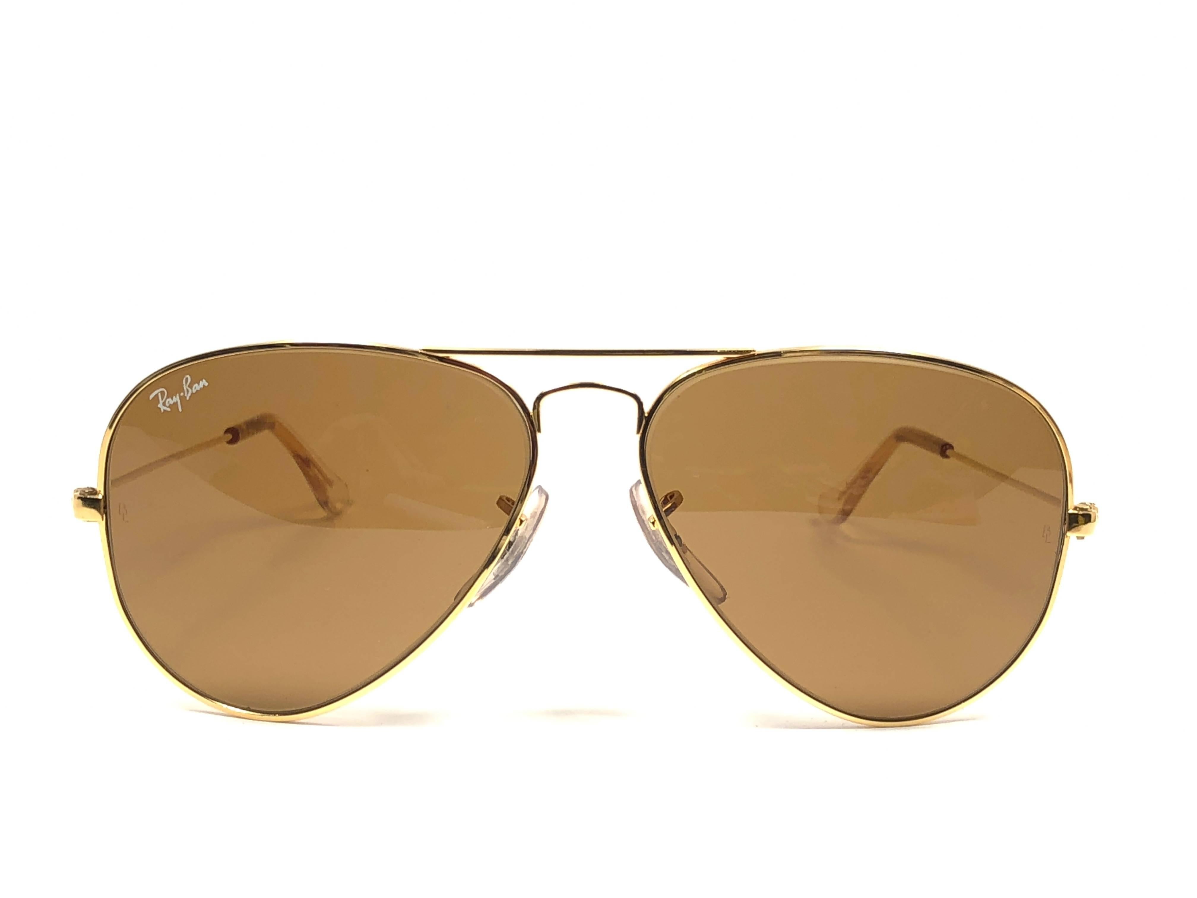 New Super special vintage Ray Ban Aviator Gold frame with B&L B15 Brown Lenses in SIZE 58!! Amazing top gradient mirror lenses.
Comes with its original Ray Ban B&L case. 
Rare and hard to find in this new, never worn or displayed condition. This