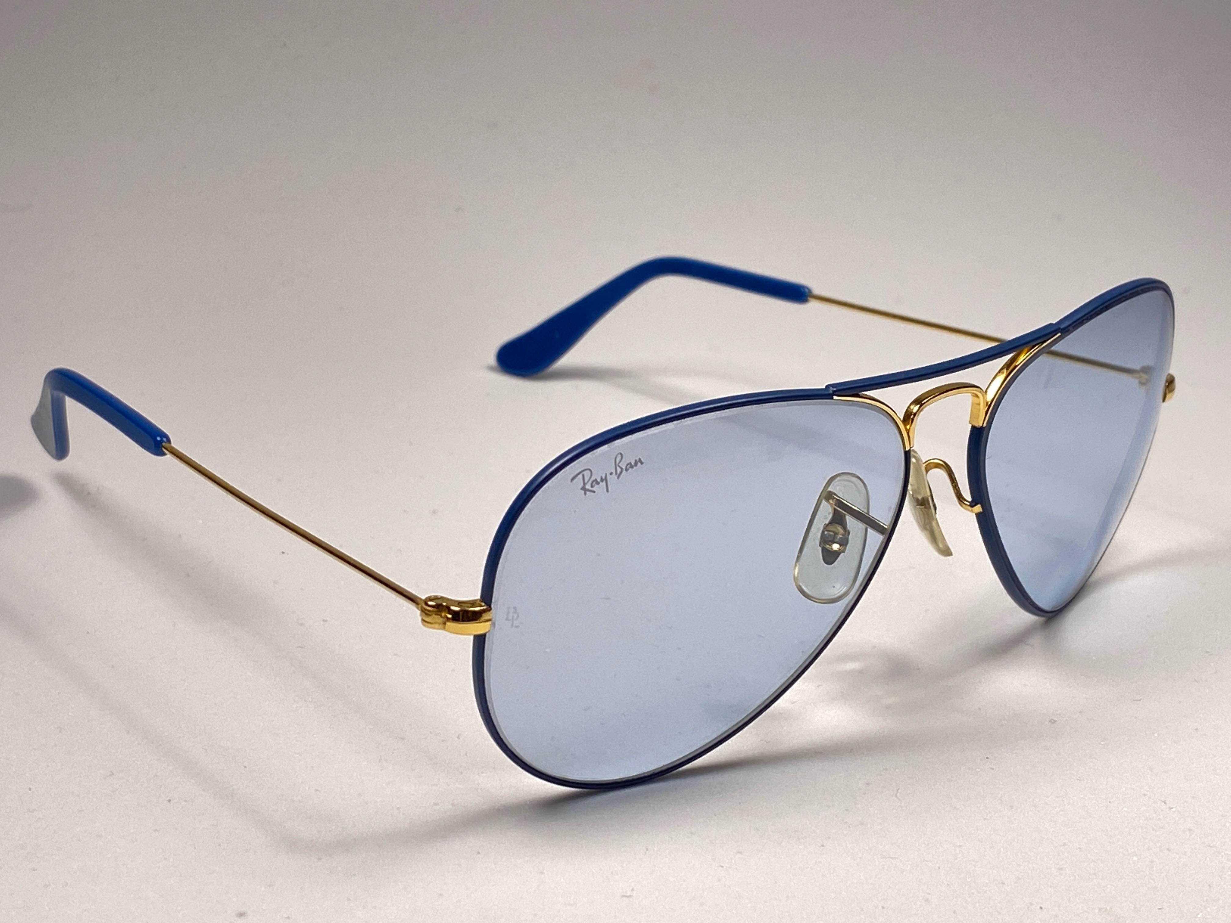 New Vintage Ray Ban Flying Colors Series in cobalt with blue changeable lenses. B&L etched in both lenses. Comes with its original Ray Ban B&L case. 
Please notice this pair show minor sign of wear due to nearly 40 years of storage. 
A seldom piece
