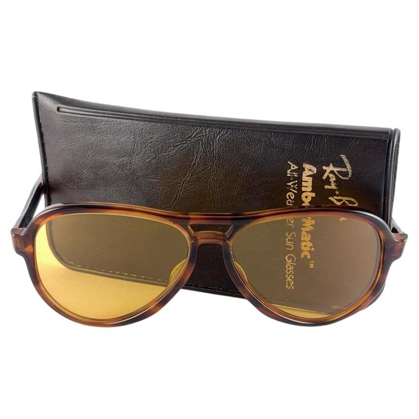New and rare vintage Vagabond tortoise frame holding a spotless pair of Ambermatic lenses. 
New, never worn or displayed. This pair may have minor sign of wear due to nearly 40 years of storage. Designed and Produced in USA.
