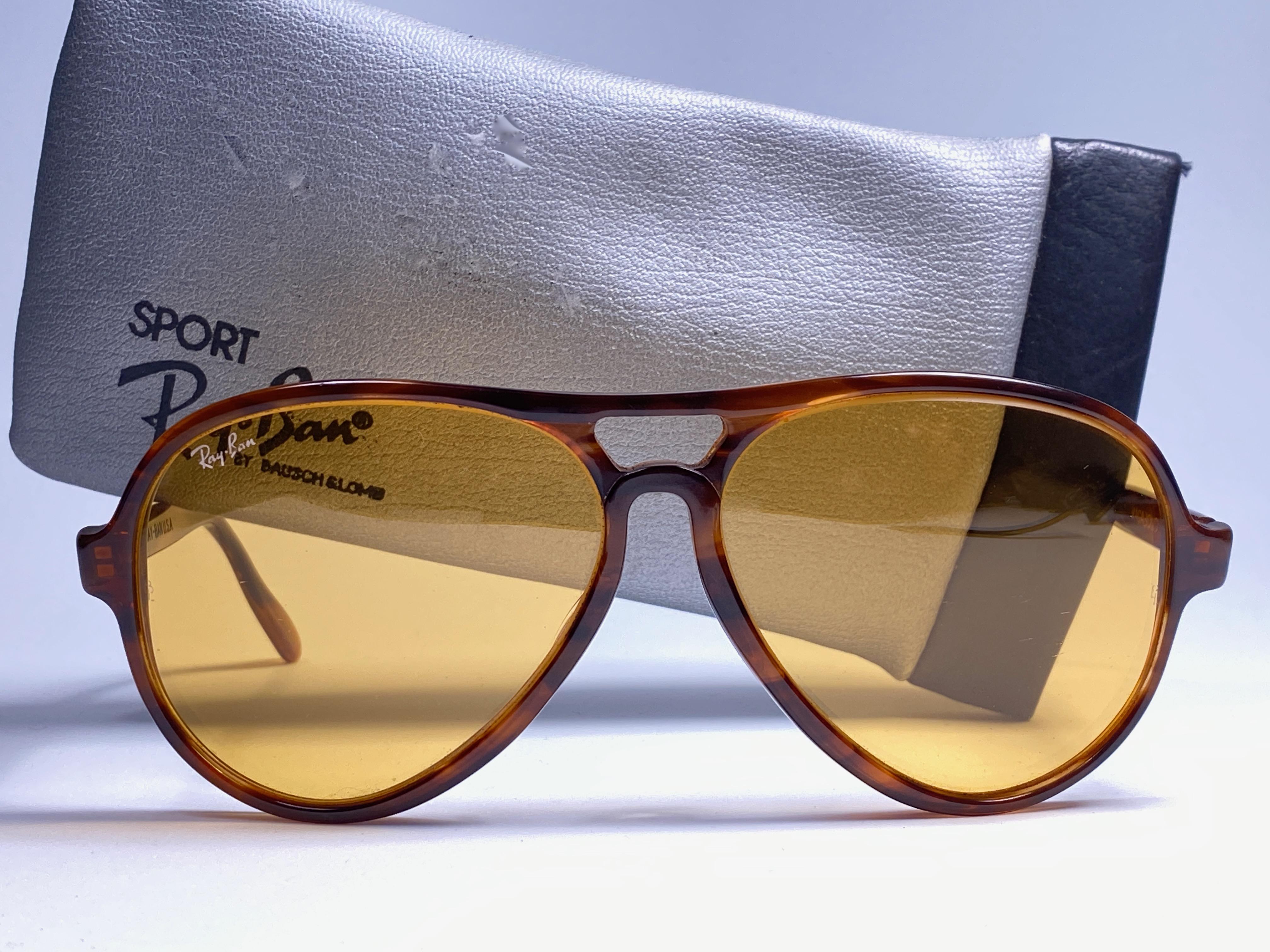 New and rare vintage Vagabond tortoise frame holding a spotless pair of Ambermatic lenses.  
New, never worn or displayed.  This pair may have minor sign of wear due to nearly 40 years of storage. Designed and Produced in USA.
