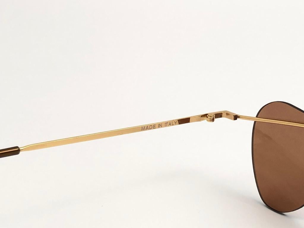 New Vintage Rimless Gold Infinity Guitars 1990 Sunglasses In New Condition For Sale In Baleares, Baleares