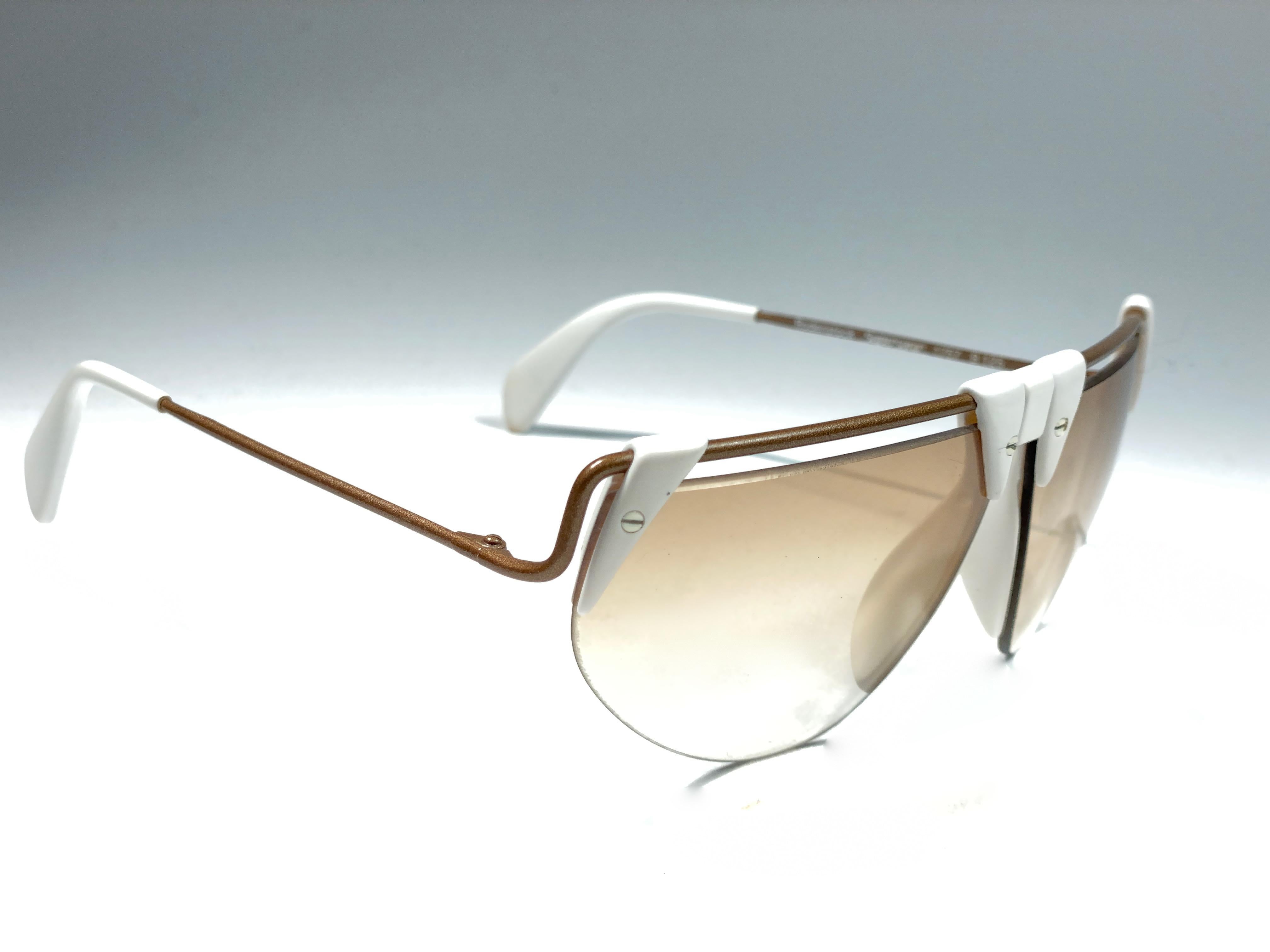 New Vintage Rodenstock sunglasses.  

Polar white accents frame sporting a pair light gradient lenses.  Never worn or displayed. 
This item show minor sign of wear due to nearly 40 years of storage.  Designed and produced in Germany.