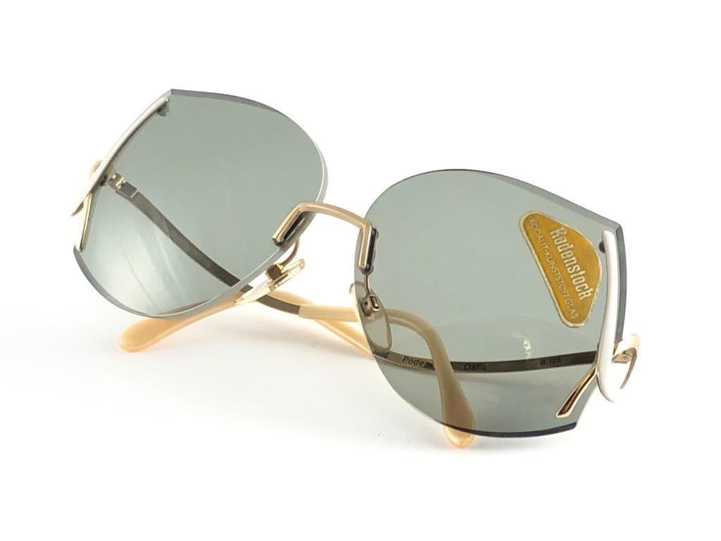 New Vintage Rodenstock Ostia Sunglasses.  

Never worn or displayed. Strong and timeless pair.
This item may show minor sign of wear due to nearly 40 years of storage.  
Designed and produced in Germany.

Front                            13 Cms
Lens