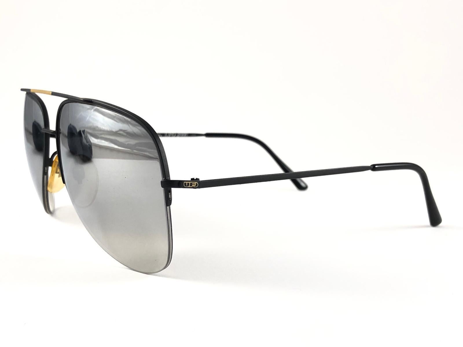 New Vintage Safilo, a balanced combination of Italian craftsmanship, design, functionality and striking aesthetics, this model showcases a Black Mate Half Frame holding a spotless Mirrored lenses.

New, never worn or displayed.
Made in