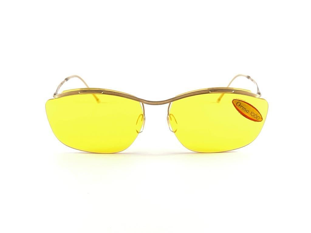
New Ultra Rare Collectors Pair Of Vintage Sol Amor Rimless 1960'S Sunglasses
Lightweight Gold Metal Frame Holding Original Yellow Lenses
This Pair May Show Minor Sign Of Wear Due To More Than 60 Years Of Storage


Made In France


Front            